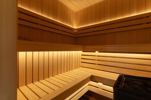 a sauna with wooden walls and a ceiling at Willa Paula in Ząb