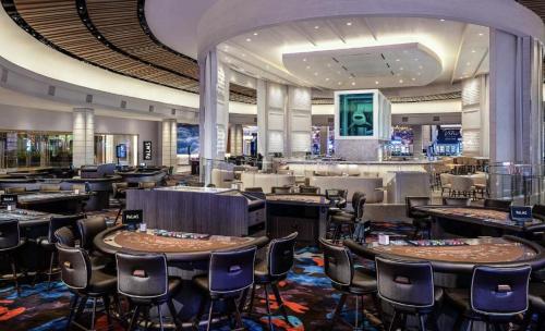 a restaurant with tables and chairs in a casino at Palms Place Hotel StripView with Open Balcony -33 in Las Vegas