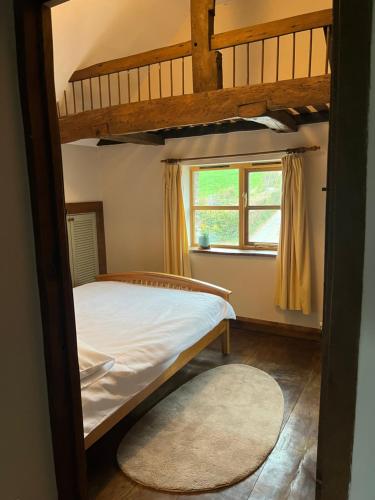 Ένα ή περισσότερα κρεβάτια σε δωμάτιο στο Beautiful country cottage