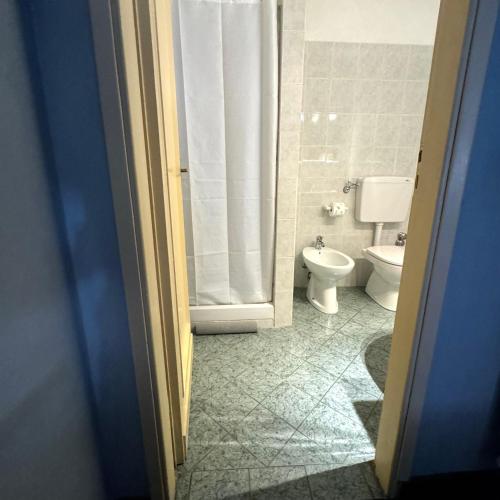 a bathroom with a toilet and a shower at Hotel Cestelli in Florence