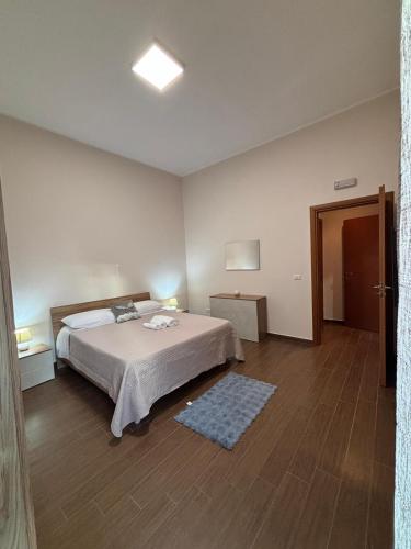 a bedroom with a large bed in a room at La Fenice Central in Reggio Calabria