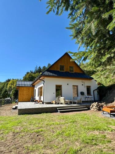 a large white house with a roof at Chata pod Jabloňou in Banská Štiavnica