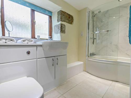 a bathroom with a sink and a shower and a toilet at 2 Bed in Portreath OLDMM in Camborne