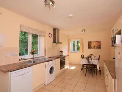 a kitchen with a sink and a dishwasher at 1 Bed in Kilve KILVE in Kilve