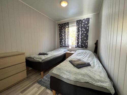 a bedroom with two beds and a window at Arctic Wonderland in Senja