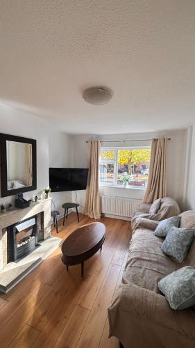 a living room with a couch and a table at Cardinal Court , Wilton 3BR Beside CUH Hospital in Cork