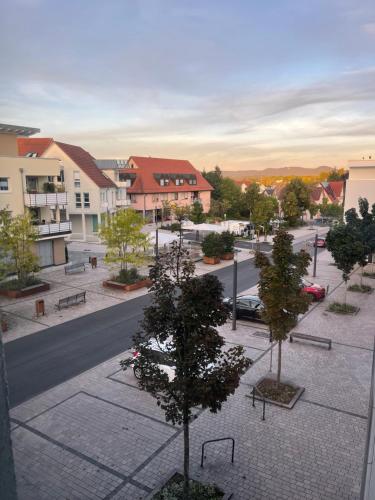 a view of a town with trees and a street at Exclusives 3 Zimmer Apartment in Zimmern ob Rottweil