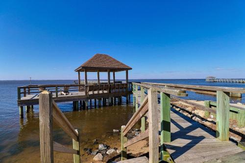 a wooden pier with a gazebo on the water at NV8 - HAPPY hOURS ON THE SOUND in Jay Crest