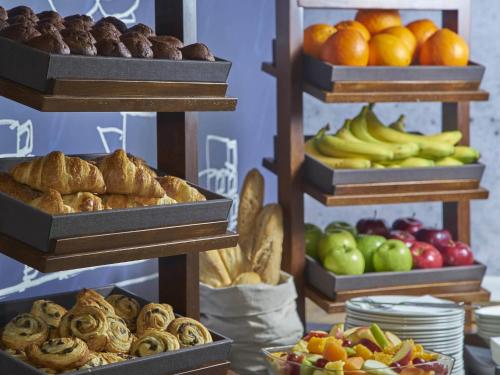 a display of different types of bread and fruit at ibis budget Manchester Salford Quays in Manchester