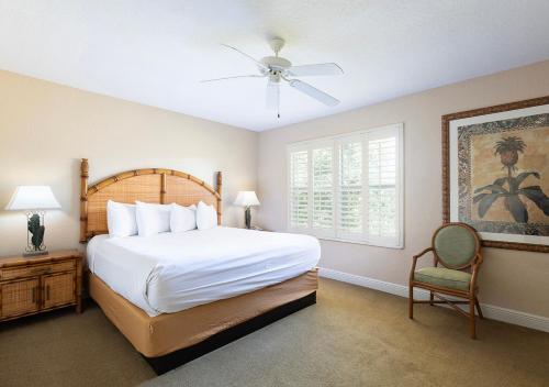 a bedroom with a large bed and a window at Villas at Regal Palms Resort & Spa in Davenport