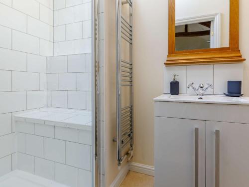 a bathroom with a shower and a sink at 2 Bed in Ashreigney 75412 in Ashreigney