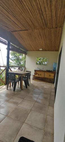 a room with benches and a wooden ceiling at Surf Lodge El Carrizal-Punta Mango in La Periquera