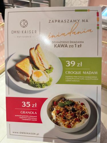 a box of breakfast food with toast and eggs at Apartamenty Paryskie Old Town View in Toruń