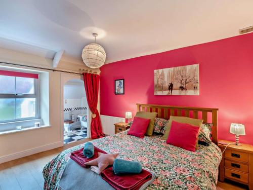 a child laying on a bed in a bedroom at 4 Bed in Rothbury CN180 in Rothbury