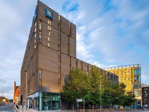 a building with a sign on the side of it at ibis Budget Manchester Centre Pollard Street in Manchester