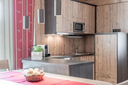 Kuchyň nebo kuchyňský kout v ubytování Chalet Resort Sölden