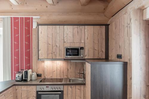 Kuchyň nebo kuchyňský kout v ubytování Chalet Resort Sölden