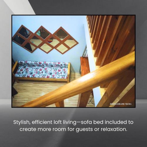 a room with wooden floors and a staircase with wooden beams at Belnidoloft apartment near airport unit1 in El Nido