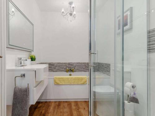 a bathroom with a glass shower and a sink at 1 Bed in Kewstoke 78986 in Weston-super-Mare