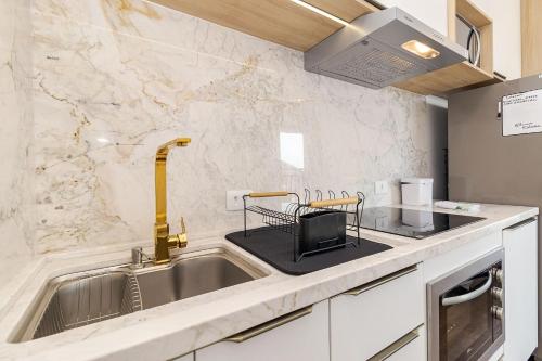 Η κουζίνα ή μικρή κουζίνα στο One House – Academia, Piscina e Coworking | Gonzaga Stays