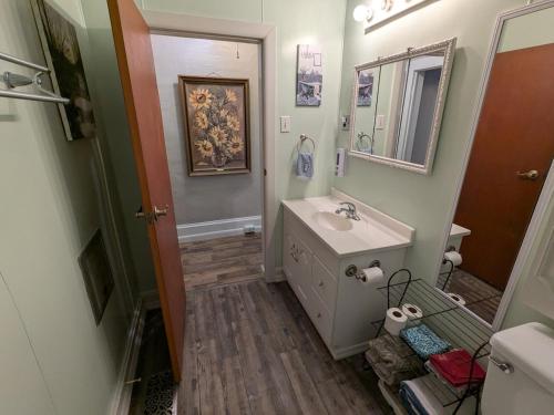 a bathroom with a sink and a mirror at MinCo Properties WV, Carswell Hollow Overlook in Kimball