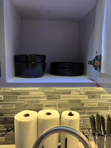 a bathroom with two rolls of toilet paper and a sink at Casa Luna Royale in San Juan
