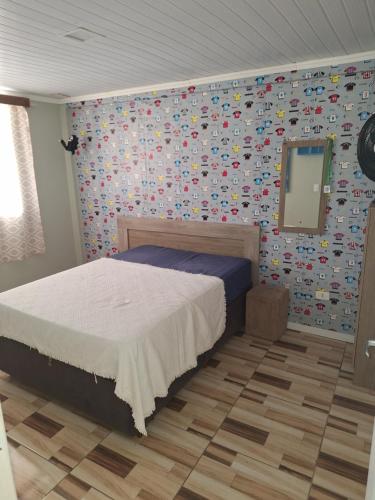 Ένα ή περισσότερα κρεβάτια σε δωμάτιο στο Família Motta