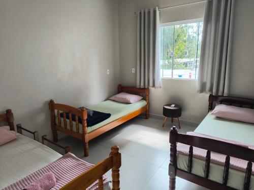 En eller flere senge i et værelse på Apartamento Praia centro 03