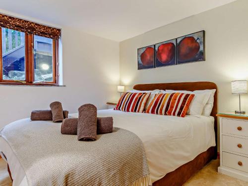 a bedroom with two beds and a window at 2 Bed in Fowey 76446 in Golant