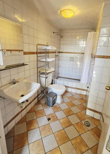 a bathroom with a toilet and a sink at La Casona de Jerusalen in Arequipa