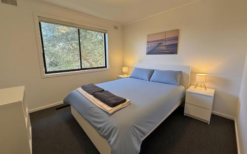 Ένα ή περισσότερα κρεβάτια σε δωμάτιο στο Beauna Vista Beach Retreat