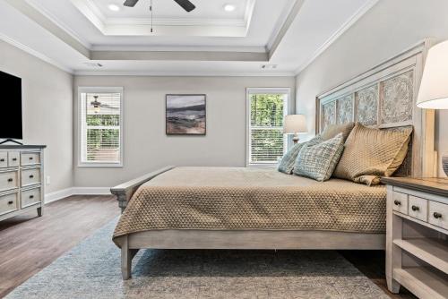 Ένα ή περισσότερα κρεβάτια σε δωμάτιο στο The 54th Cottage Close to Commerce Shopping