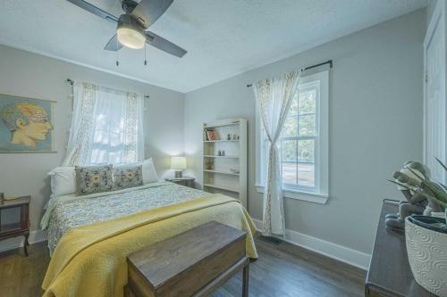 a bedroom with a bed and a ceiling fan at Eclectic Inn Downtown - 2 miles to Sanford Stadium in Athens