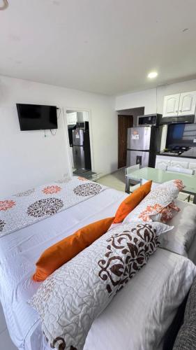 two beds sitting next to each other in a room at estudio 1121b in Cartagena de Indias