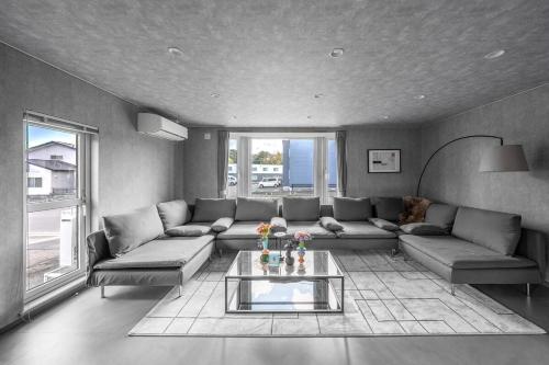 a living room with a couch and a table at The Arklune in Sapporo