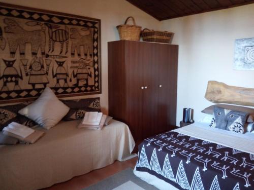 Ένα ή περισσότερα κρεβάτια σε δωμάτιο στο B&B Vigna Rosa