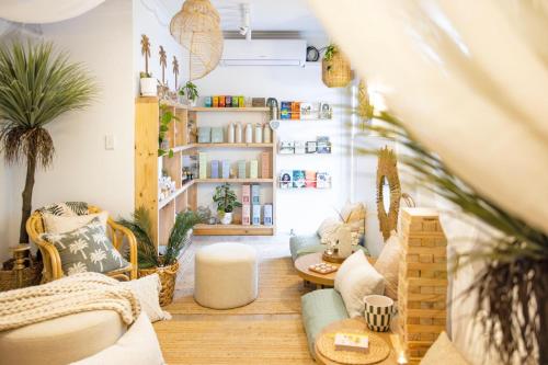 a living room with potted plants and a couch at Barossa Palms Motel in Nuriootpa