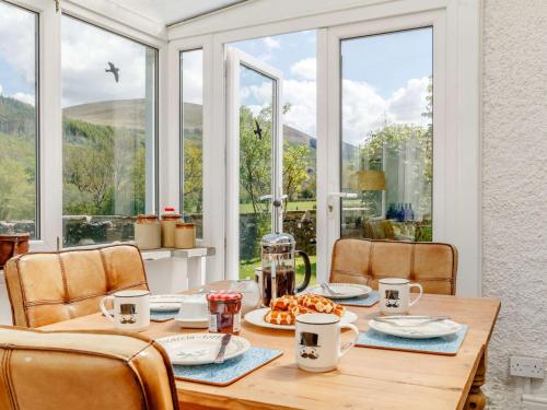a dining room with a table with food on it at 2 Bed in Talybont-on-Usk BN249 in Talybont
