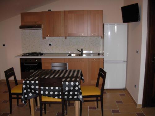 Kuchyň nebo kuchyňský kout v ubytování Hotel Michelangelo