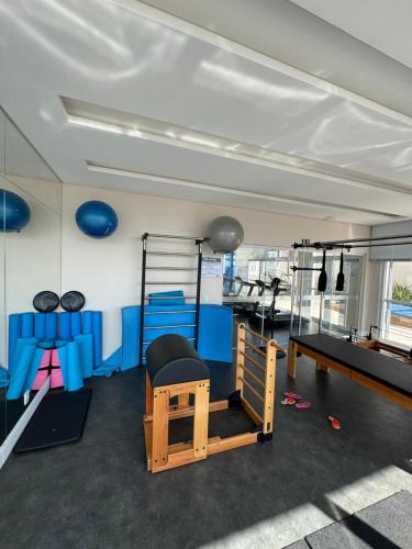 a room with a gym with a simulator at Studio Luxo JH 706 Best Location in Gleba - 1 Quarto in Londrina