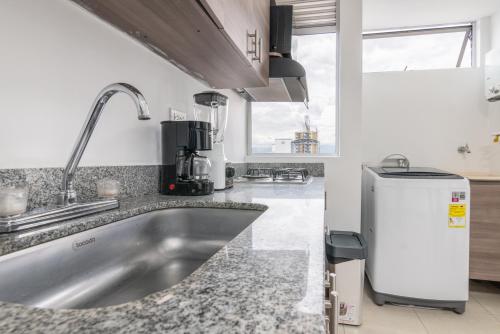 Kuchyň nebo kuchyňský kout v ubytování Vegas PH Suites