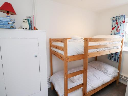 a bunk bed room with two bunk beds at 51 Longstone Park in Chathill