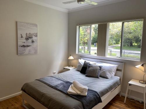 En eller flere senge i et værelse på Chapman Cottage