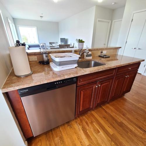 a kitchen with a sink and a counter top at Spacious Apt in Fairview NJ Easy Commute to NYC with parking in Fairview