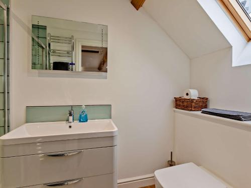 a bathroom with a sink and a mirror at 1 Bed in Curry Rivel 41489 in Curry Rivel