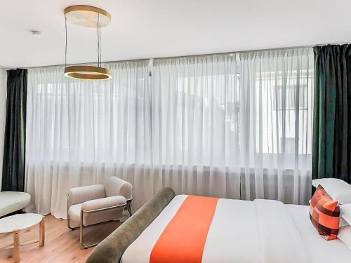 Ένα ή περισσότερα κρεβάτια σε δωμάτιο στο Modern and Elegant 1BR Apartment City Center