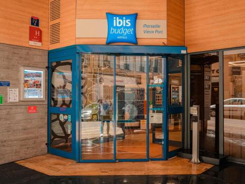 a bus lobby with a blue sign in a building at ibis budget Marseille Vieux Port in Marseille