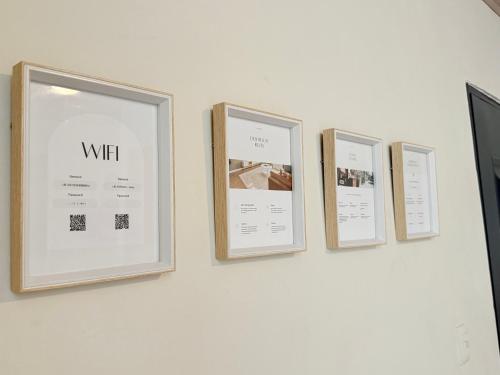 a group of three pictures hanging on a wall at Casa Blu - Vacation home in Chitre in Chitré