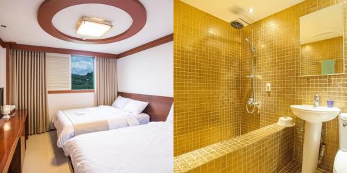 a bathroom with two beds and a sink and a shower at Benikea Hotel Cheong Do Hot Spring in Cheongdo