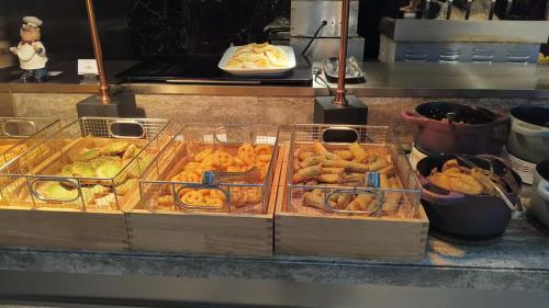 two trays of food sitting on a counter at Mercure Suzhou Shilu Shantang in Suzhou